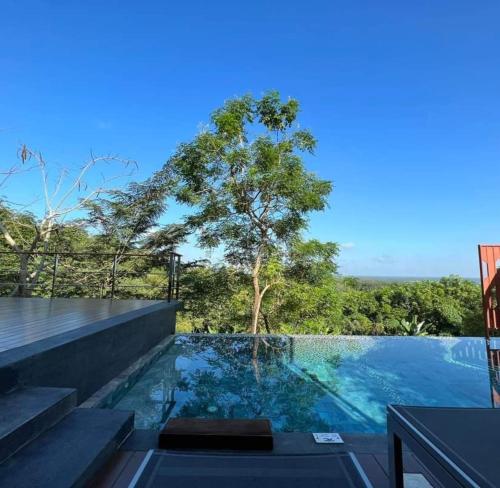 a swimming pool in a house with a view at Sky View Luxury Pool Villa - SHA in Surat Thani