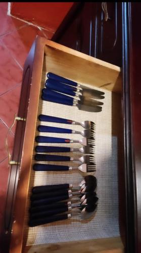 a box full of brushes sitting on a table at Departamento en Cuenca in Cuenca