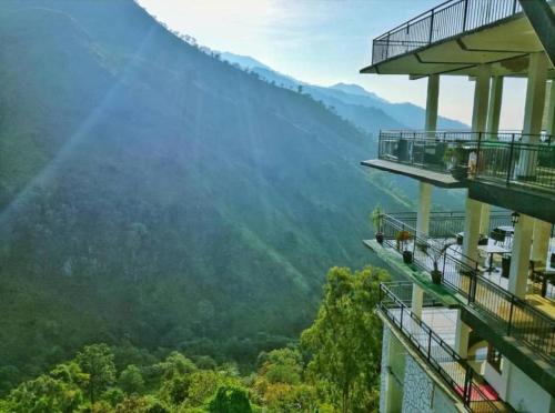 a view of the mountains from the balcony of a building at Ella Mount Heaven in Ella