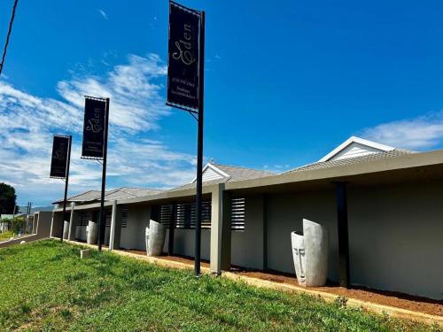 a row of flags in front of a building at EDEN BOUTIQUE HOTEL in Kokstad