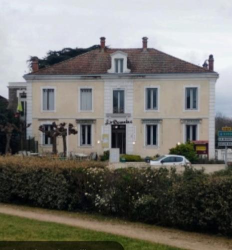 a large white house with a car in front of it at Le Domaine in Moustey