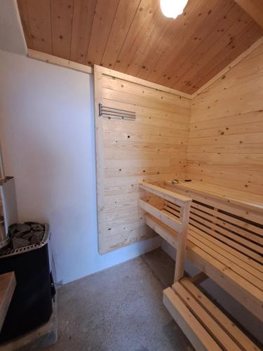 a wooden sauna with a bench in a room at Casa Martin , 4 bedroom villa in Bisenti