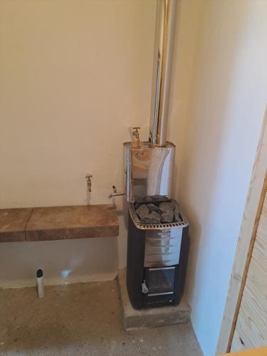 a coffee maker in a corner of a room at Casa Martin , 4 bedroom villa in Bisenti