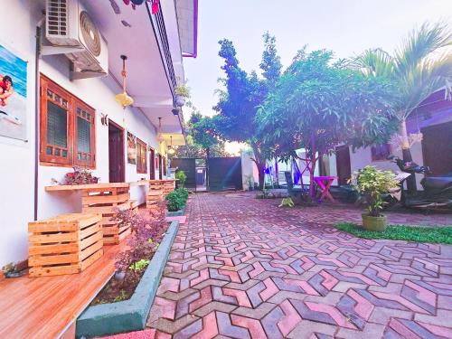 a brick walkway in front of a building at Chill Airport Transit Stay in Katunayake