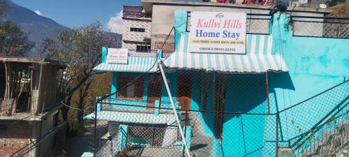 a home stay sign on the side of a building at Kullvi hill homestay in Shamshi