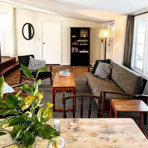 a living room with a couch and a table at Myrtlemae Farm in Balingup