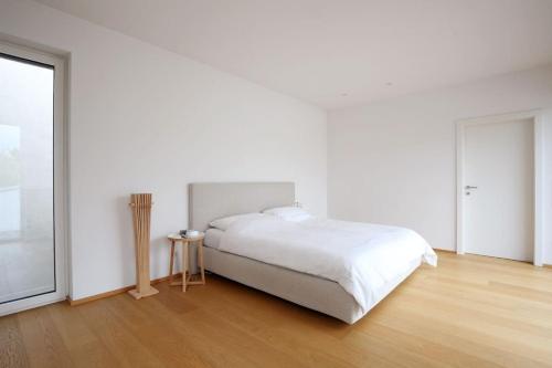 A bed or beds in a room at Elegantes Haus zum Wohlfühlen