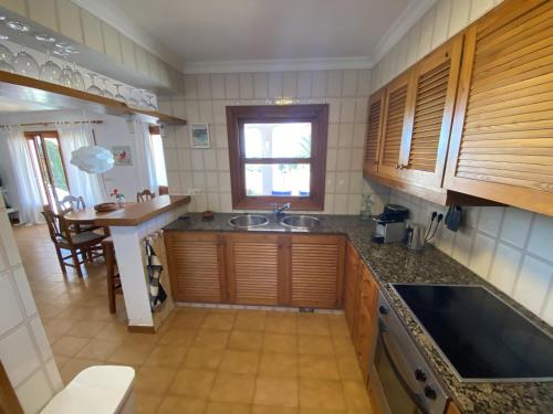 a kitchen with a sink and a counter top at Villa GALERA in Son Bou