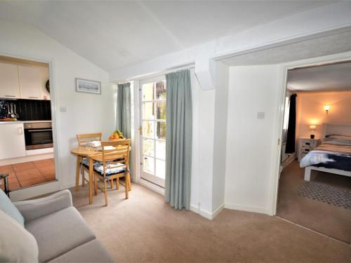 a living room with a couch and a table at 1 Bed in Torquay 36488 in Torquay