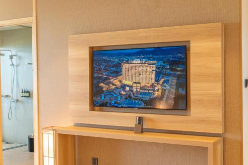 a flat screen tv on top of a wall at Da Nang - Mikazuki Japanese Resorts & Spa in Da Nang