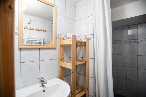 a bathroom with a sink and a mirror at Chalupa Morávka 1 v Beskydech in Morávka