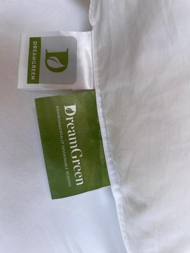 a pair of white pants with a green tag on them at Cosy caravan fun in sunny Nelson with wifi! in Nelson