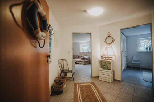 a room with a hallway with a living room at Friesenhus Dangast in Dangast