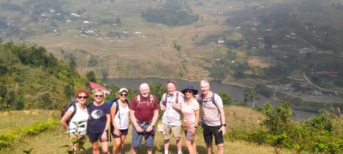 a group of people standing on top of a hill at Hmong Eco Villas in Sa Pa