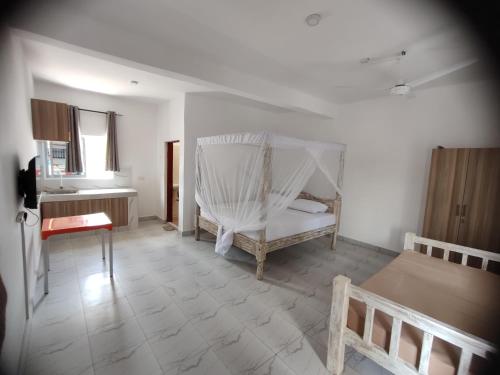 Postel nebo postele na pokoji v ubytování Butah Gardens Watamu