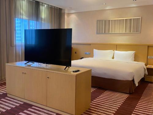 Park Inn by Radisson Shanghai Downtownにあるテレビまたはエンターテインメントセンター