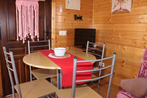 a dining room with a table and chairs at Cabañas Caudiel in Caudiel