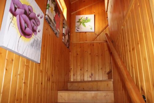 a staircase in a wooden room with a staircase at Cabañas Caudiel in Caudiel