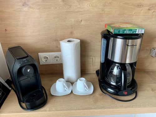 a coffee maker sitting on top of a counter at Appartement Alpenhof Wildschönau in Niederau