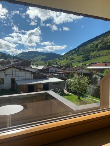 a large window with a view of a city at Appartement Alpenhof Wildschönau in Niederau