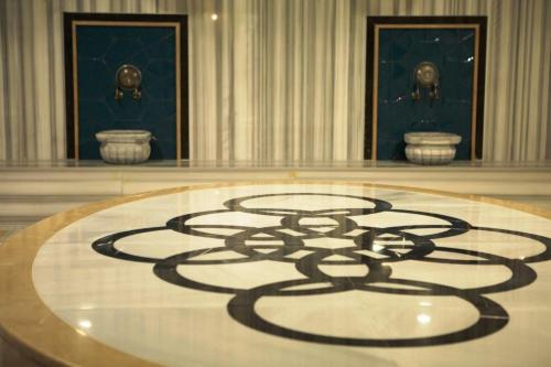 a large room with a large symbol on the floor at Sunprime C-Lounge - Adult Only in Alanya