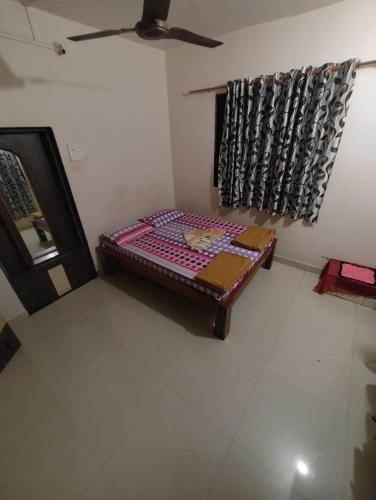 Ein Bett oder Betten in einem Zimmer der Unterkunft Konkan Villa Dream