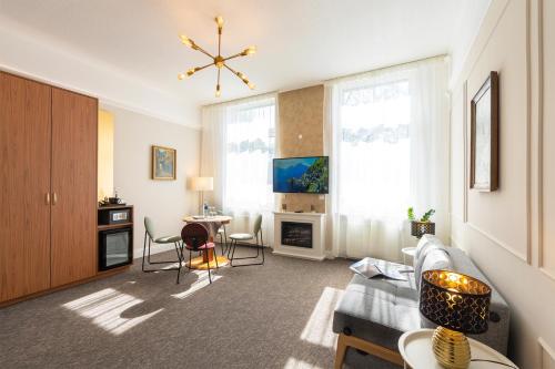 a living room with a couch and a table at Hotel Kleiner Riesen in Koblenz