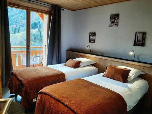 Ένα ή περισσότερα κρεβάτια σε δωμάτιο στο Chalet La Ferme d'Aimé, neuf, 15 personnes