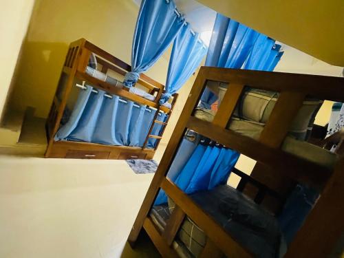 Voodi või voodid majutusasutuse Luanda City Hostel toas
