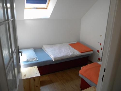 Ένα ή περισσότερα κρεβάτια σε δωμάτιο στο Penzión Anika