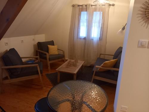 Χώρος καθιστικού στο Chambres d'hôtes Le Gentil Home