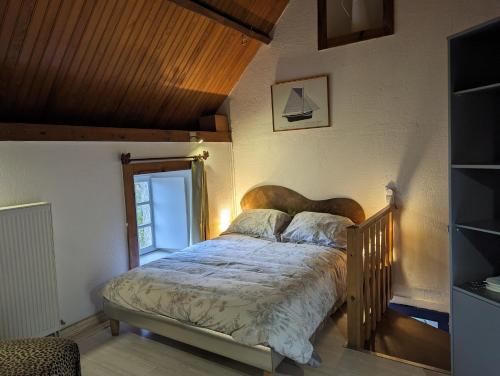 En eller flere senge i et værelse på Moulin à Orge