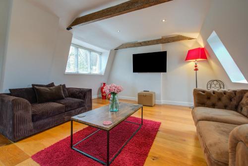 a living room with two couches and a tv at Spacious Townhouse on Quiet Street-Wi-Fi, Desk in Stamford