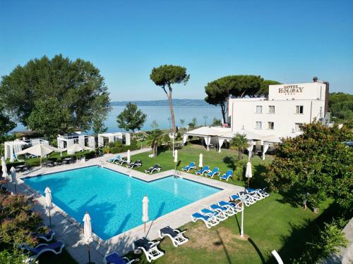 an aerial view of a resort with a swimming pool at Hotel Holiday Sul Lago in Bolsena