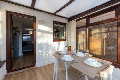a dining room with a wooden table and chairs at Orchard House - 2 bedroom house, Central Alnwick in Alnwick