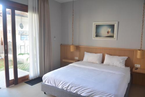 Postel nebo postele na pokoji v ubytování THe Kind Homestay