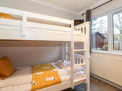 Ένα ή περισσότερα κρεβάτια σε δωμάτιο στο Hill Lodge