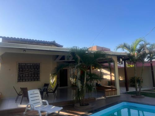 a villa with a swimming pool and a house at CASA PÔR DO SOl in Alter do Chao
