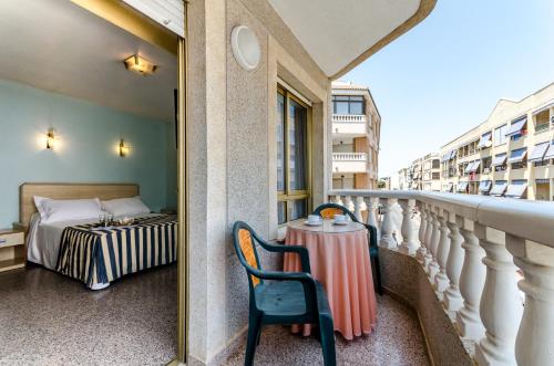Postel nebo postele na pokoji v ubytování Hotel Mediterráneo