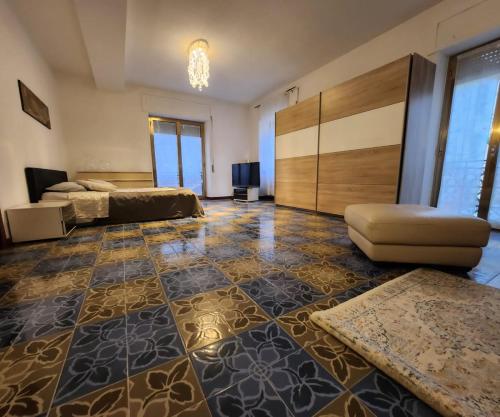 a large room with a bed and a couch at La Famosa Dimora Ambasciatore in San Marino