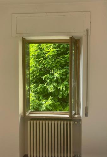 an open window in a room with a radiator at La Famosa Dimora Ambasciatore in San Marino