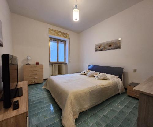 a bedroom with a bed and a television in it at La Famosa Dimora Ambasciatore in San Marino