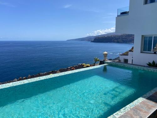 a swimming pool with a view of the ocean at Villa Oasis La Paz - Romen Studio - ADULTS ONLY in Puerto de la Cruz