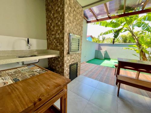 Ένα ή περισσότερα κρεβάτια σε δωμάτιο στο Casa de Praia - Gravatá Navegantes - SC