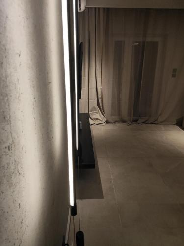a room with a silver wall with a room with curtains at Sea Stars 2 APARTMENT in Perea
