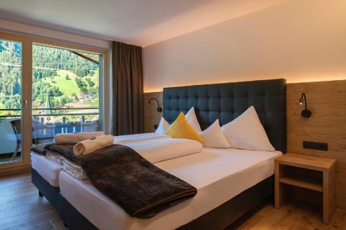 Voodi või voodid majutusasutuse Hotel Sonnblick toas