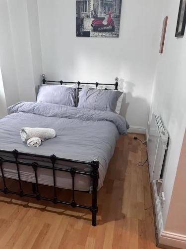 a bed in a room with a bed frame at Goswell Road Studio for 3 - Central London Retreat in London