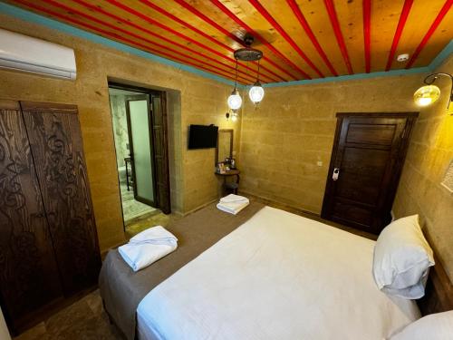 Voodi või voodid majutusasutuse Rustic Caves toas