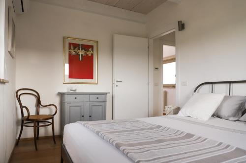Łóżko lub łóżka w pokoju w obiekcie Villa l'Essiccatoio Deluxe Morcella