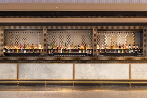 a bar with a lot of bottles of alcohol at InterContinental London - The O2 in London